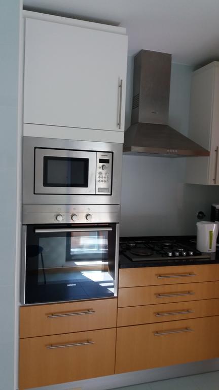 Apartamento Novo Com Piscina โอลเญา ภายนอก รูปภาพ